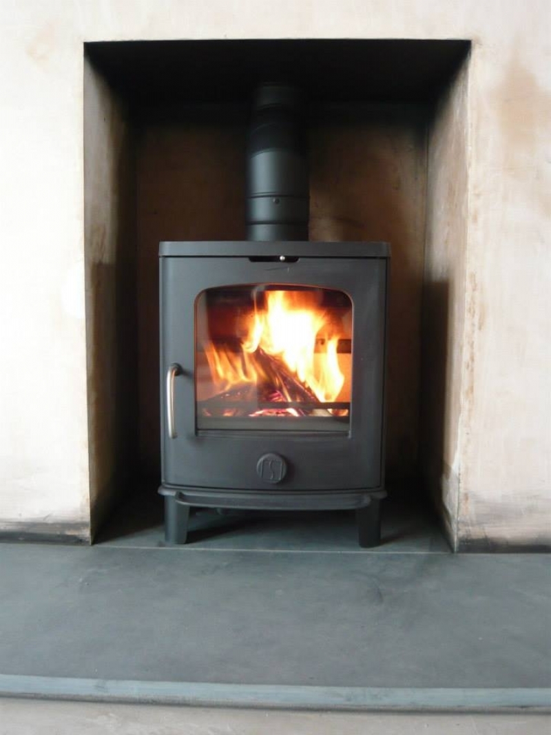 Scan Andersen woodburner in a newly plastered fireplace burning installation from Fires.